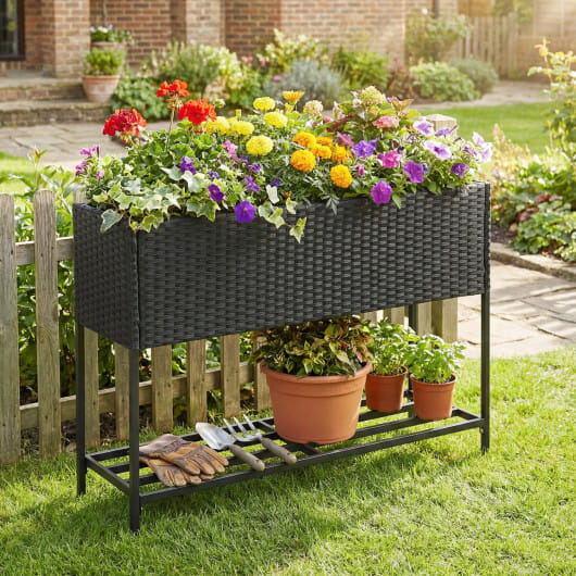 Wicker Raised Garden Bed with Storage Shelf and Drainage Gaps for Flowers - Image 7