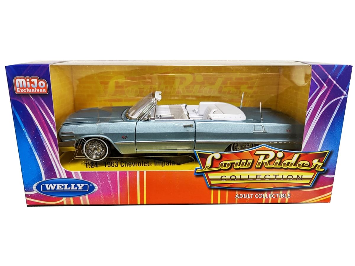 1963 Chevrolet Impala Convertible Lowrider Light Blue Metallic with White Interior “Low Rider Collection” 1/24 Diecast Model Car by Welly