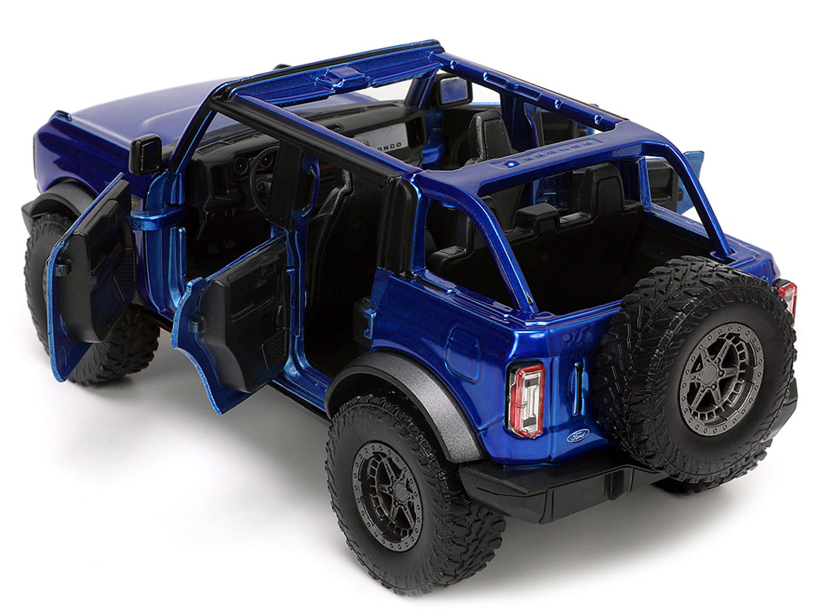 2021 Ford Bronco Open-Top Candy Blue Metallic with Extra Wheels "Just Trucks" Series 1/24 Diecast Model Car by Jada - Image 4