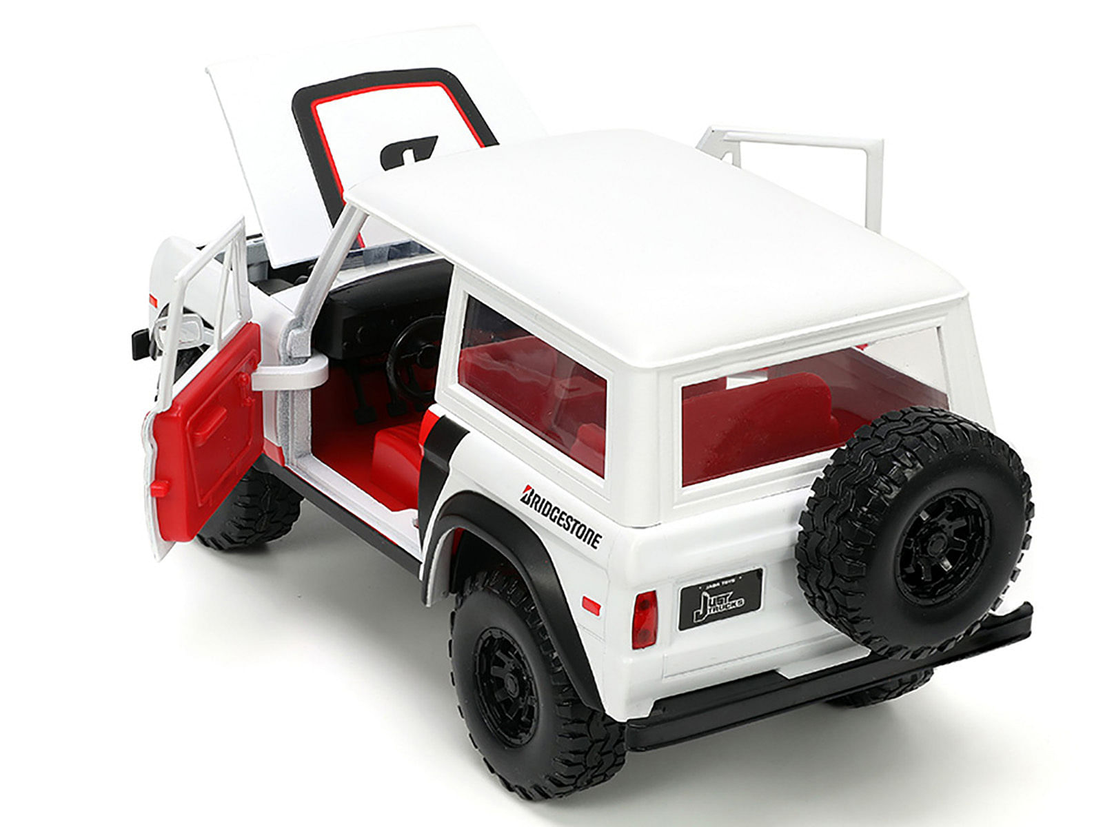 1973 Ford Bronco #008 White with Red and Black Stripes and Red Interior with Extra Wheels “Just Trucks” Series 1/24 Diecast Model Car by Jada