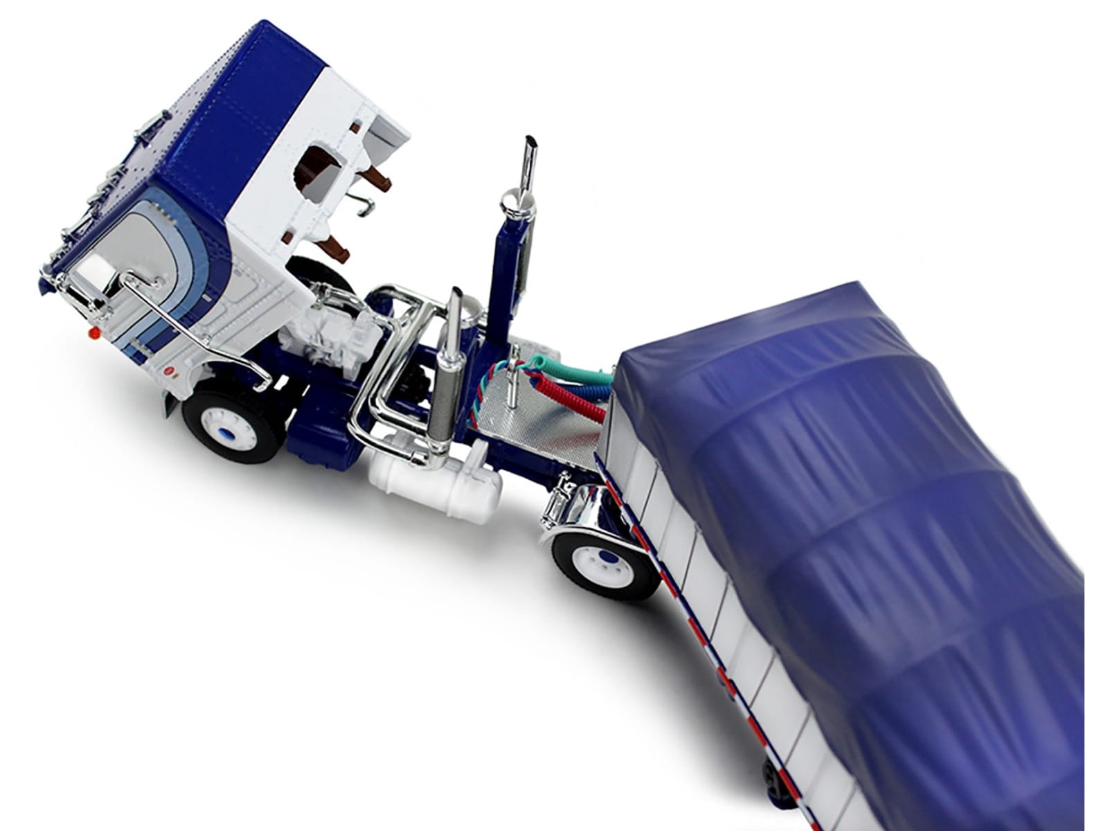 Peterbilt 352 COE 110" Sleeper and 53' Wilson Roadbrute Flatbed Trailer with Covered Wagon White with Blue Stripes 1/64 Diecast Model by DCP/First Gear - Image 2