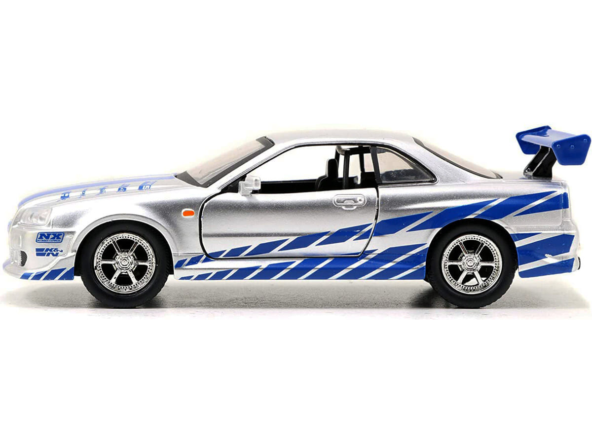 Brian's Nissan Skyline GT-R (R34) RHD (Right Hand Drive) Silver Metallic with Blue Stripes "2 Fast 2 Furious" (2003) Movie "Fast & Furious 25th Anniversary" Series 1/32 Diecast Car Model by Jada - Image 2