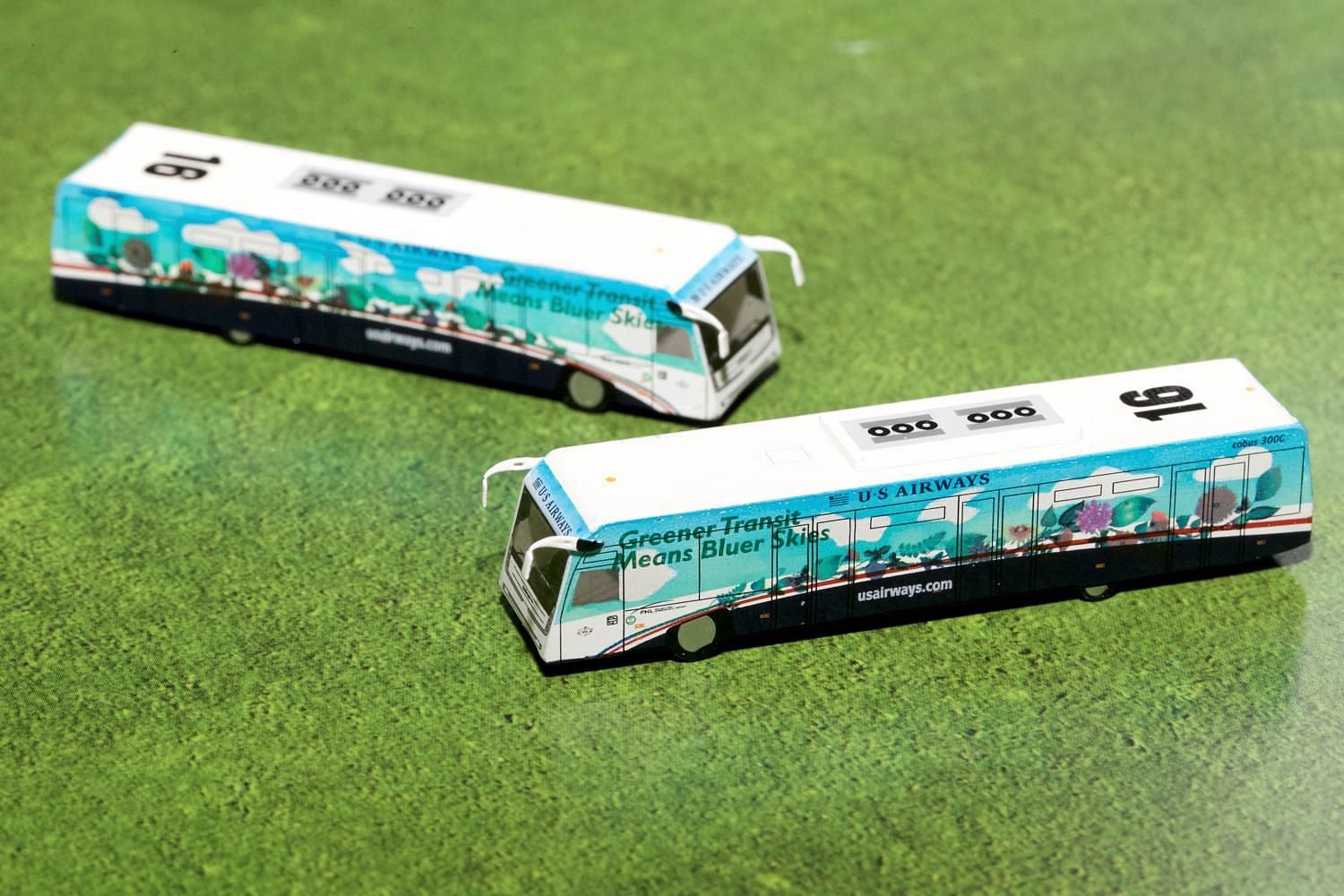 Cobus 3000 Passenger Bus White and Blue with Graphics “US Airways Shuttle Bus – Greener Transit” 2 Piece Set “Gemini 200” Series Diecast Models by GeminiJets