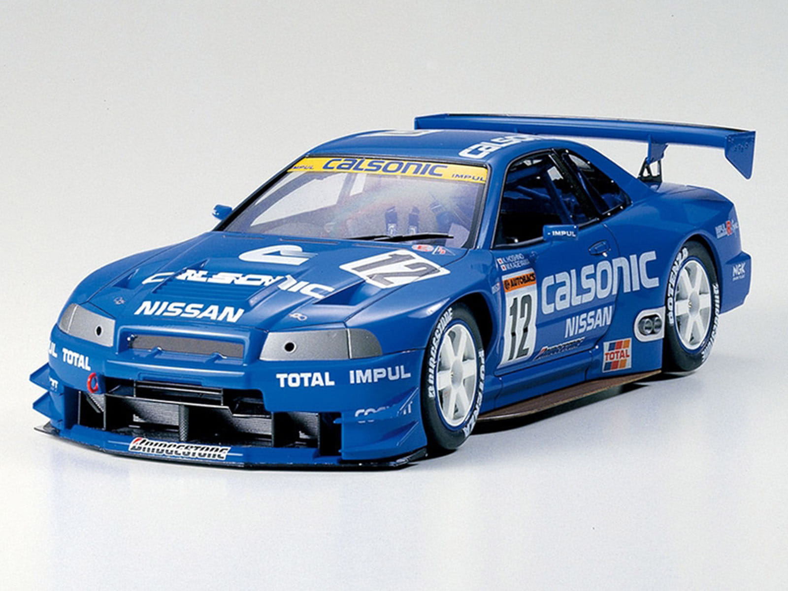 Model Kit Nissan Skyline GT-R (R34) "Calsonic" 1/24 Scale Model by Tamiya - Image 2