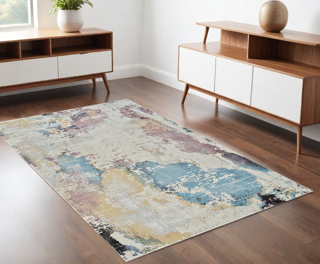 4' X 6' Beige and Blue Abstract Distressed Area Rug