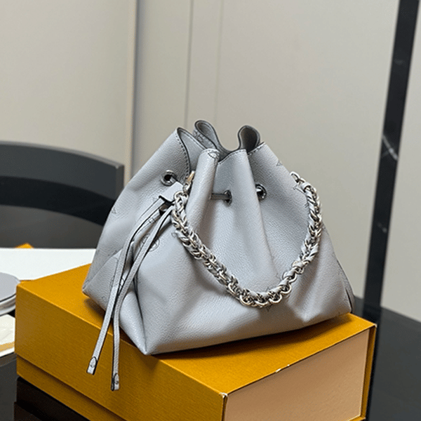 Color: Cream - Fashionable hollowed-out drawstring bucket bag, classic monogram bag, luxury designer bag, women's single-shoulder bag, high-end handbag, practical crossbody bag